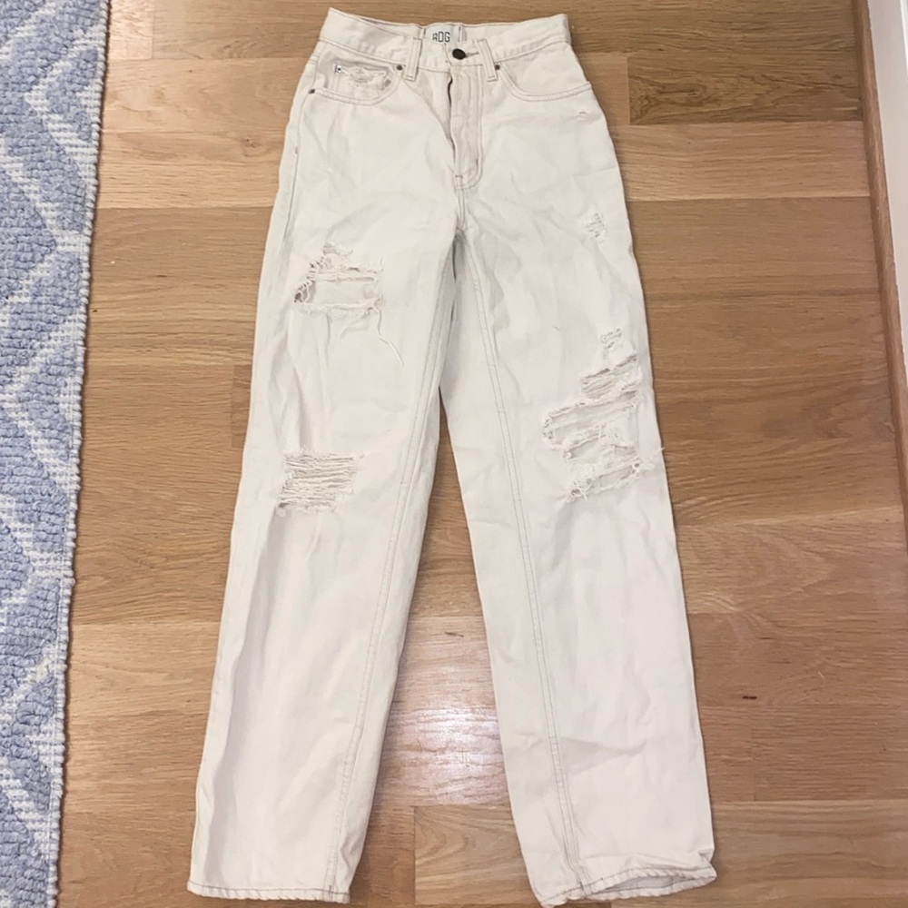 BDG, high-rise baggy distressed crème jeans.